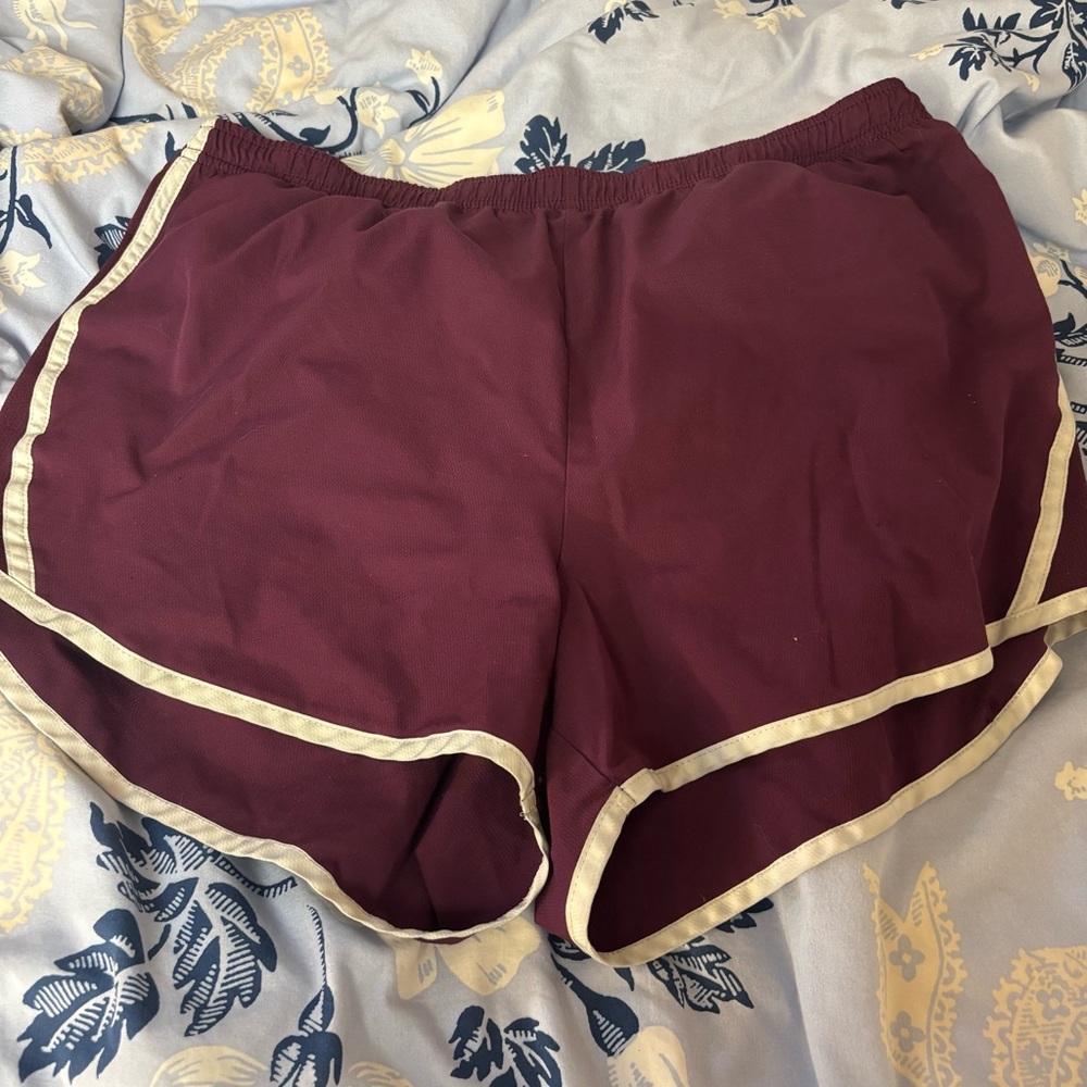 Purple athletic shorts with white trim